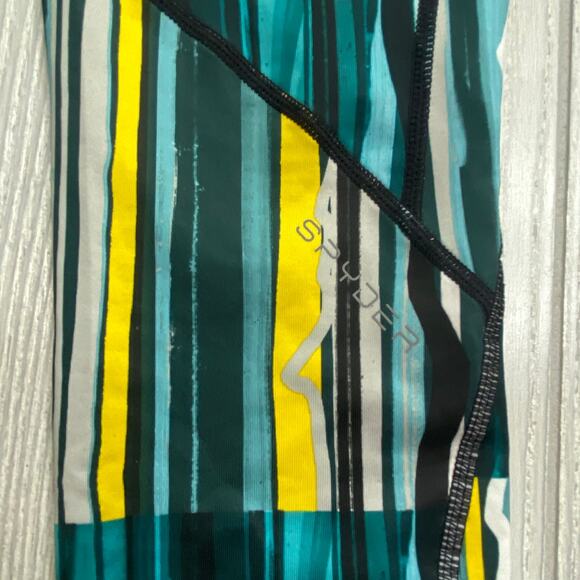 Spyder Blue Green & Yellow Freeze Stripe Print Slash Capri Leggings Size Small - Picture 11 of 11
